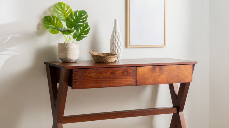 A stylish wooden console table with twin drawers