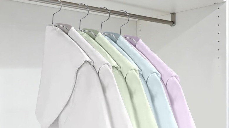 Clothes hung on folded hangers