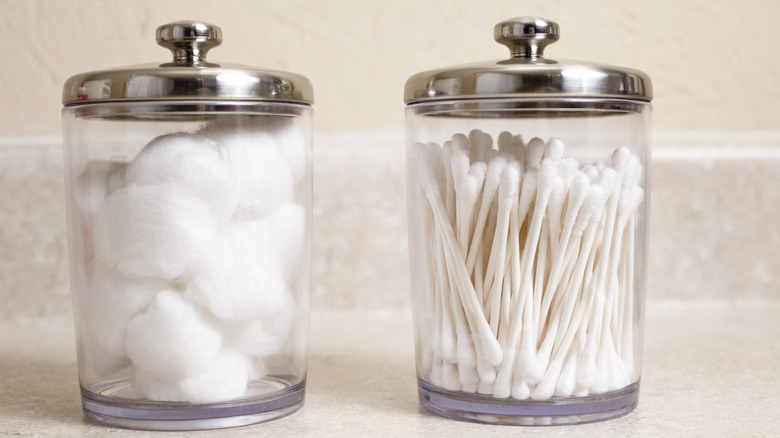Cotton swabs and cotton balls in jars