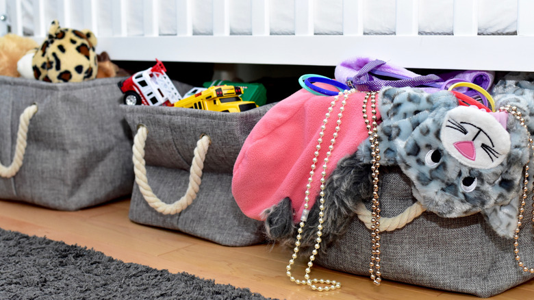 toys in bins under the bed