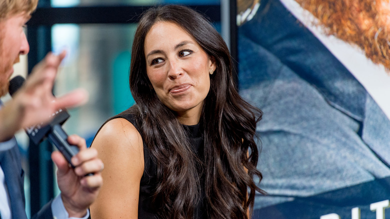 Joanna Gaines in a black shirt and soft smile