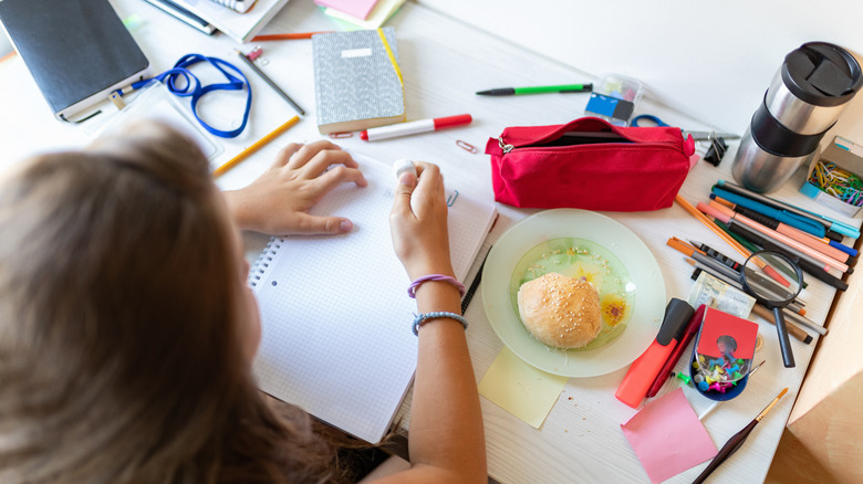 girl doing work at her desk