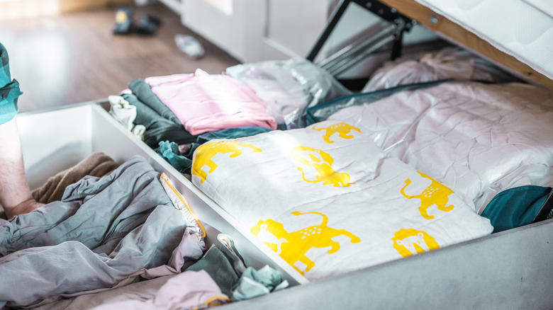 Linens in the under bed storage closeup