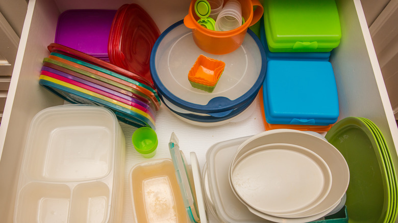 Colorful plastic containers organized in a drawer