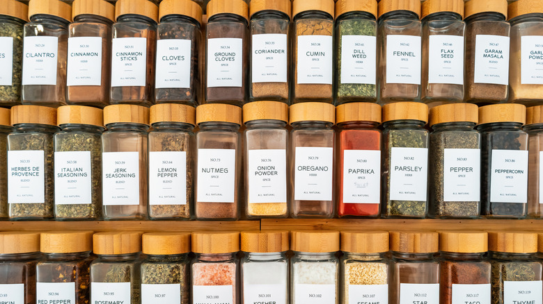Many spices laying down in a drawer