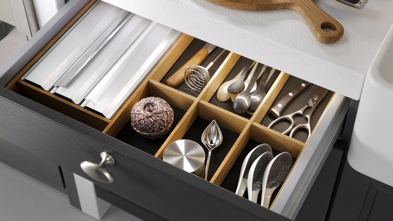 Kitchen drawer with utensils and foil dispenser
