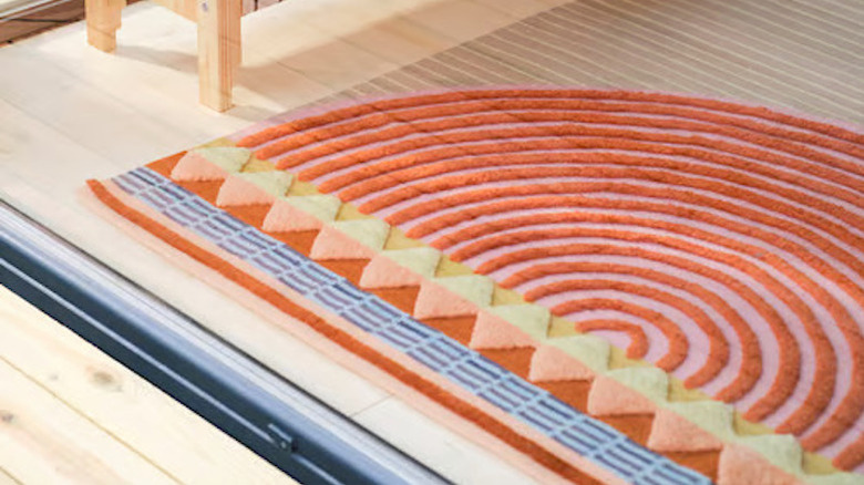 Product photo of IKEA's OMMJÄNGE flatwoven multicolor rug