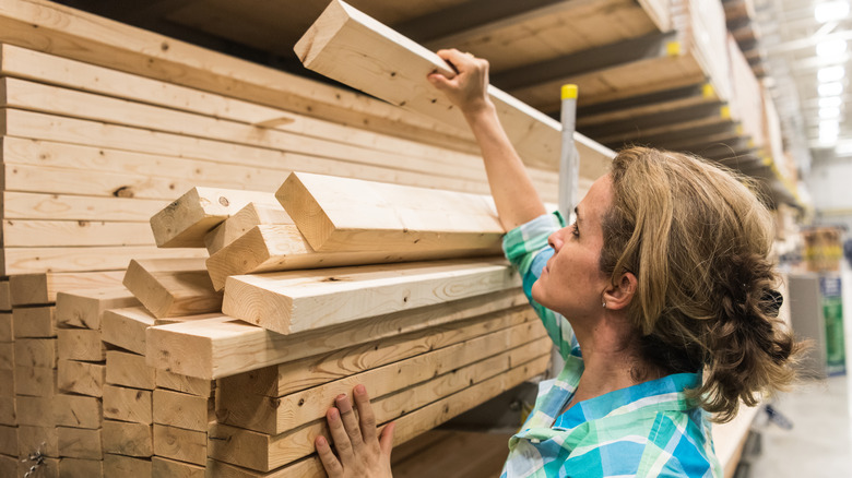 Women comparing wood at store