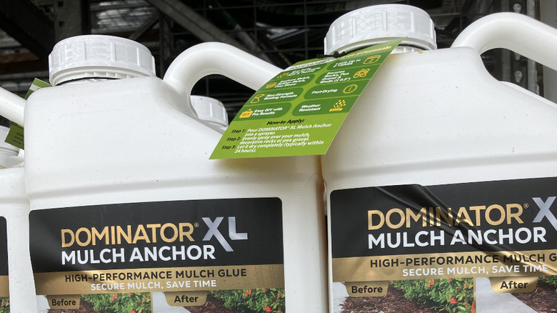 Bottles of Dominator Mulch Anchor for sale at Lowe's.