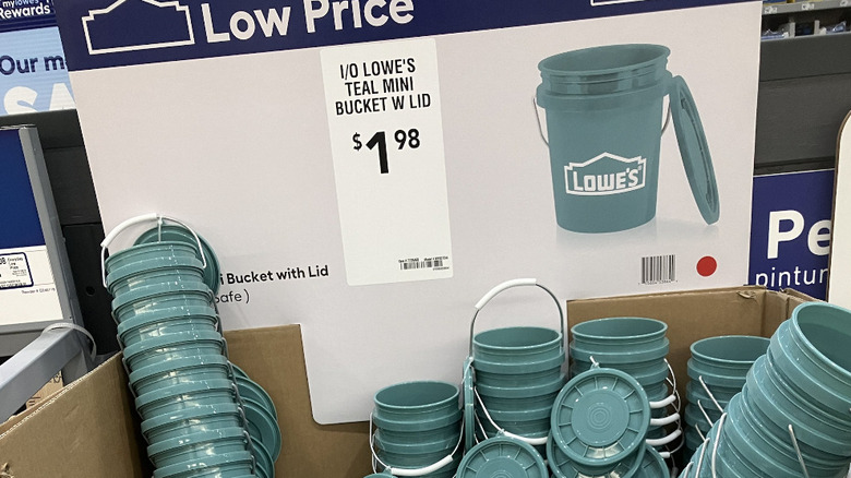 Teal mini buckets on display at Lowe's.