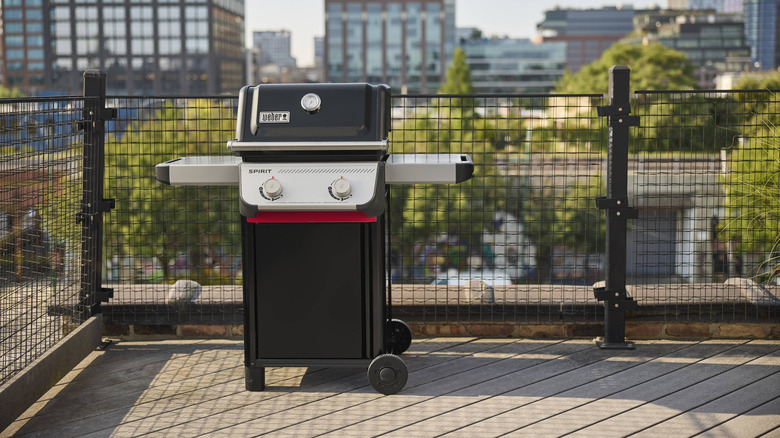 New Weber "Spirit" grill set up on a rooftop patio.