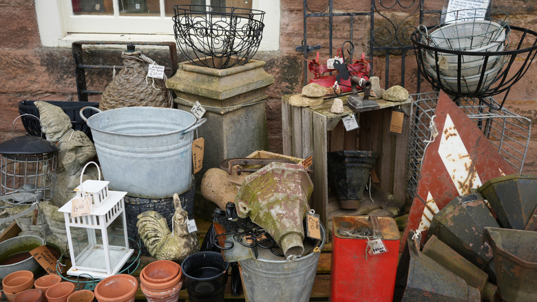 Yard sale with garden items.