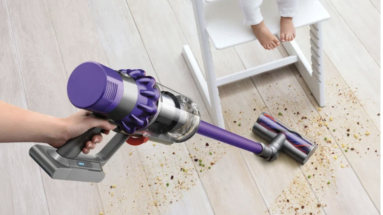 Dyson Cyclone V10 Animal + Cordless Vacuum Cleaner cleaning up food around high chair