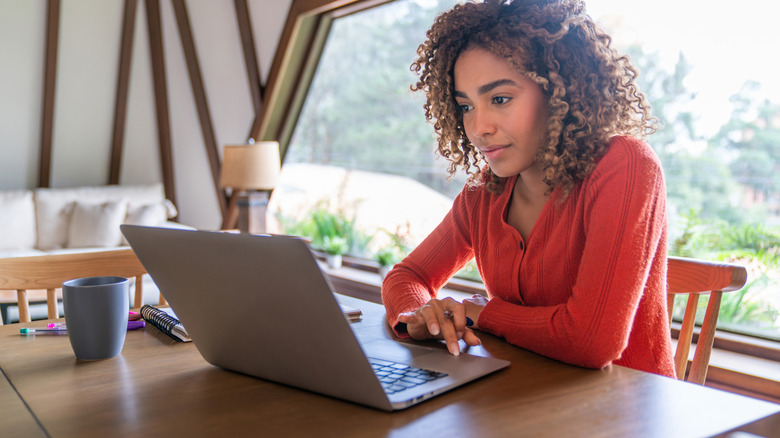 Young woman doing research on her computer