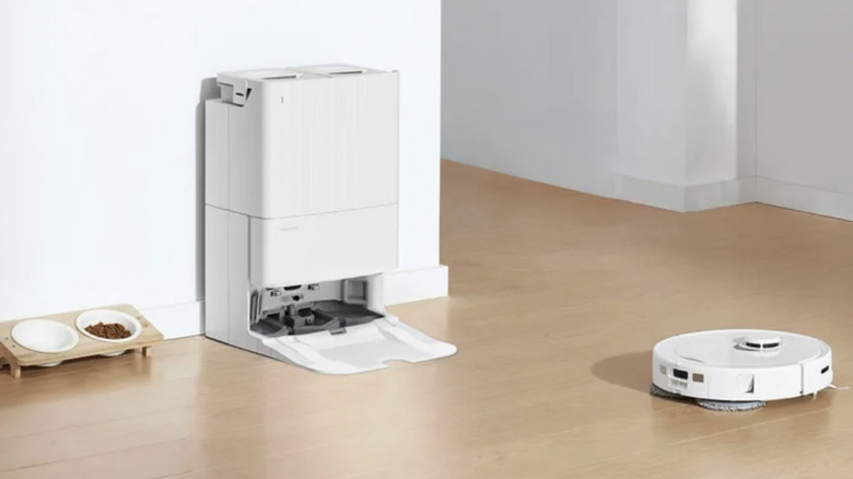 Roborock QX Revo Robot Vacuum and Mop with Multifunctional Dock cleaning in a home