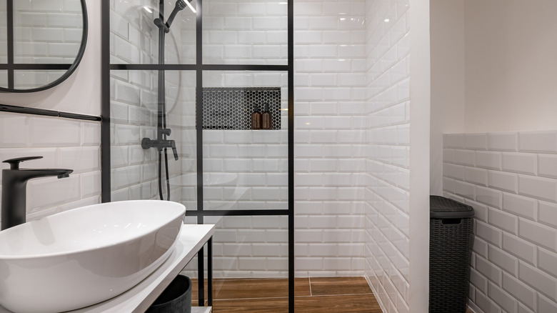 Black and white modern bathroom with high gloss tiles