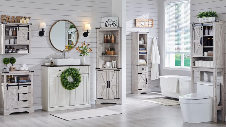 A bathroom with farm house style cabinetry