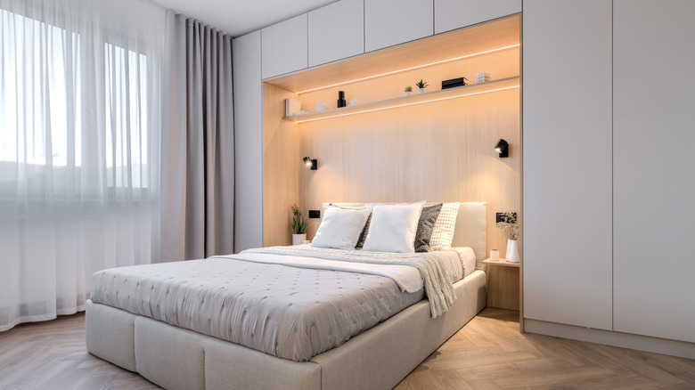 japandi bedroom with bed nook in built-in storage wall