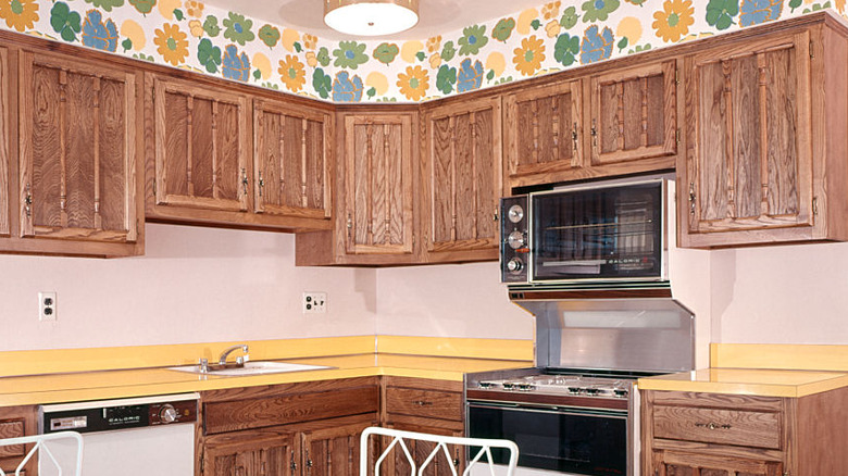 outdated yellow laminate countertop in vintage kitchen