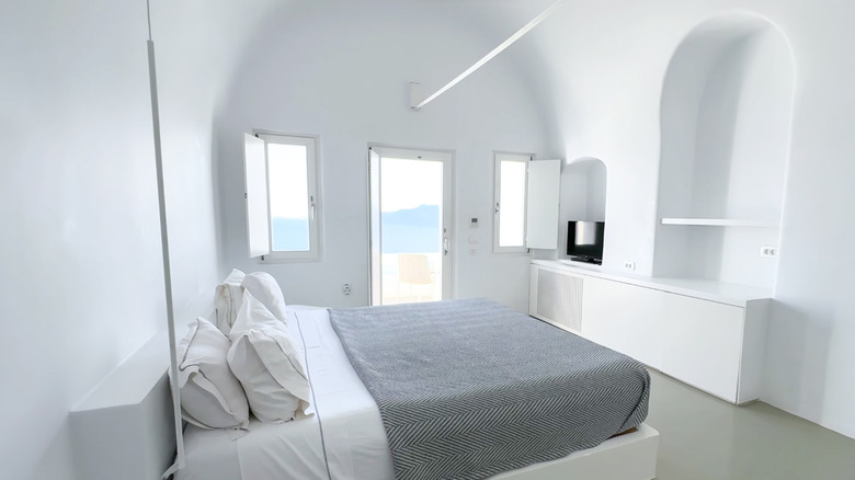 An overly stark white bedroom with no color