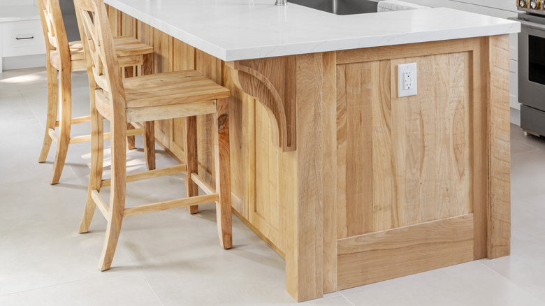 White oak chairs and island in a kitchen