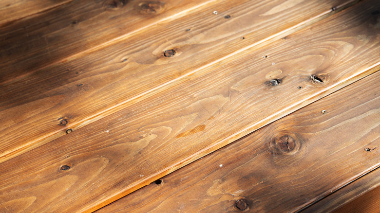 A close-up of diagonal wooden floors.