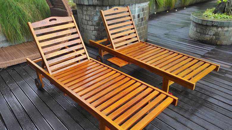 Two teak lounge chairs