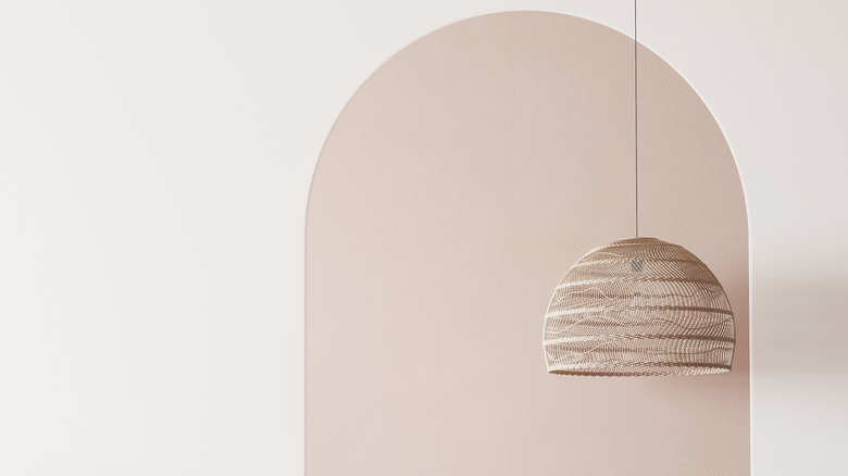 A beige painted arch on a light wall.