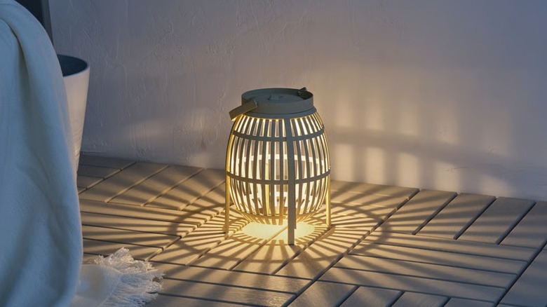 A lit solar powered decorative lamp