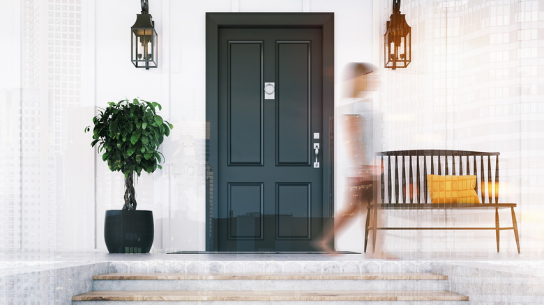 Woman walking past front entryway