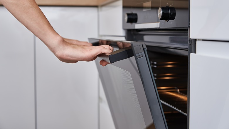 Person closing oven