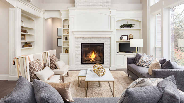 Modern fireplace and TV display in a white and gray living room