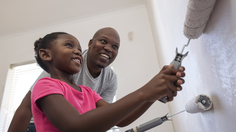 father and daughter painting room