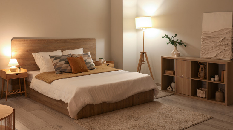 A bedroom with beige-colored walls and tan decor