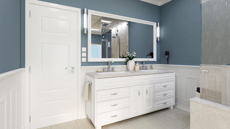 A bathroom with icy blue walls