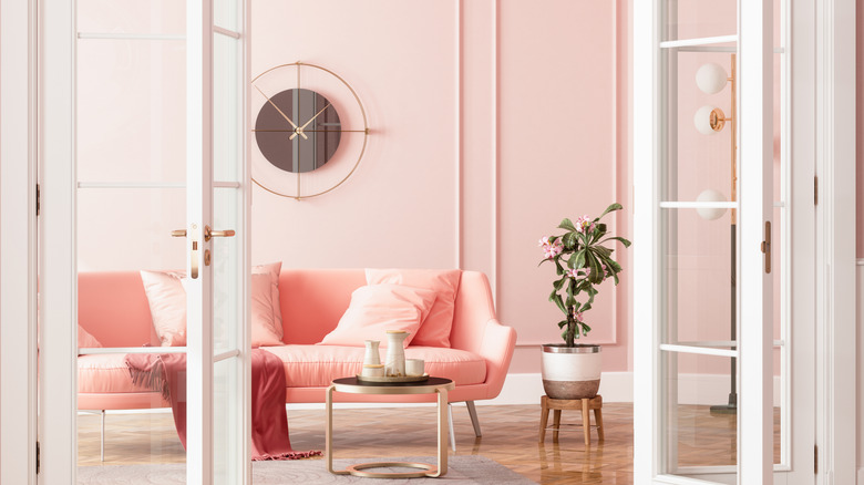 A room with millennial pink walls and decor