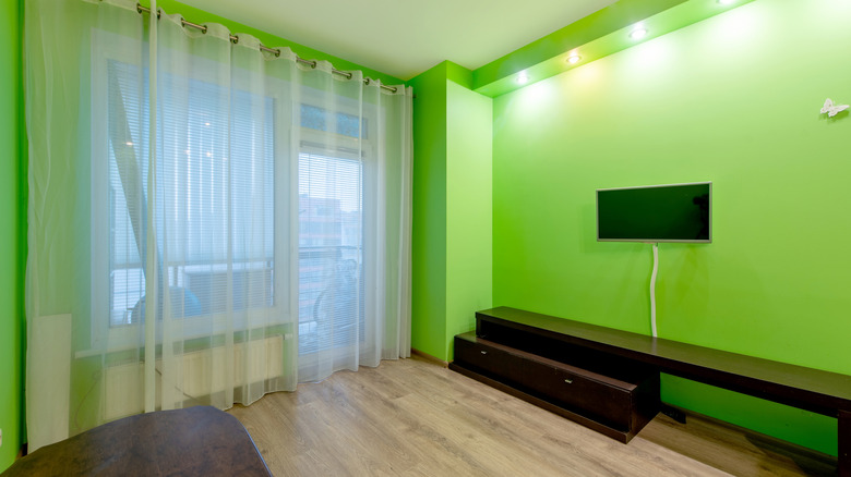 A living room with lime green walls