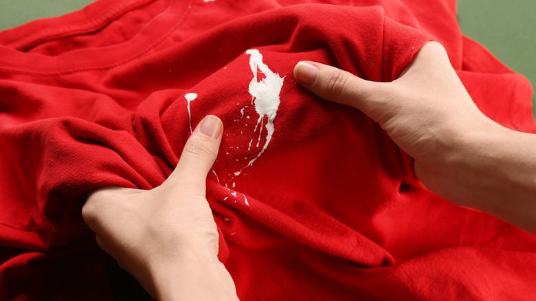 white-paint-stained red shirt