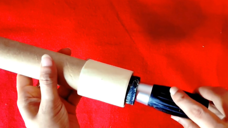 Adding a handle to a DIY lint roller made from a cardboard tube