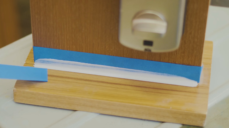 Clean caulk lines using painter's tape