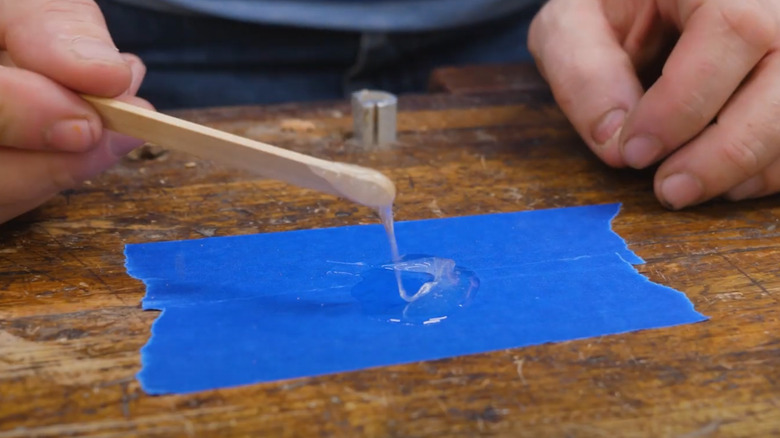 Mixing epoxy on two strips of painter's tape
