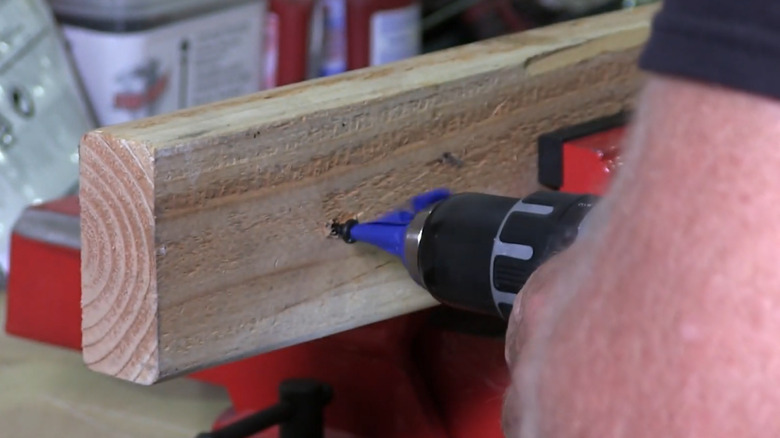 Screwing a soft screw in without damage using painter's tape