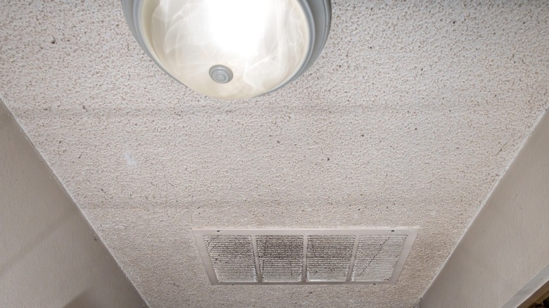 Smoke detector mounted on a popcorn ceiling
