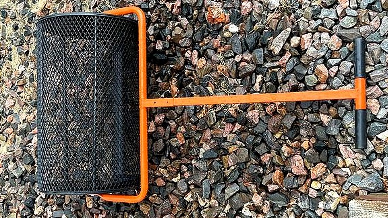 The Svopes topsoil/compost spreader on a pile of rocks, taken by customer Tom58