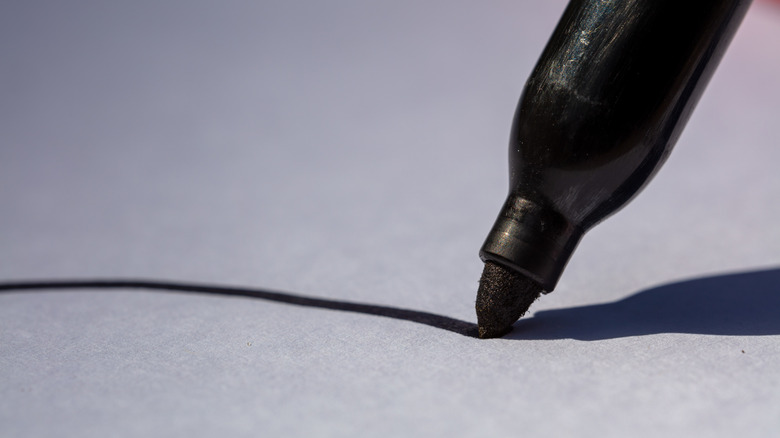 permanent marker writing white surface
