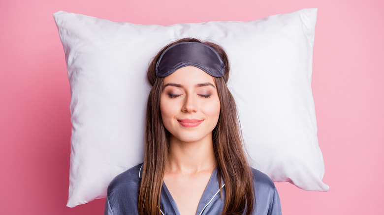 woman sleeping on pillow