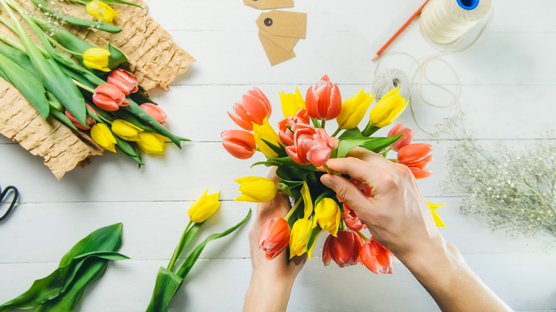 florist making a tulip bouquet