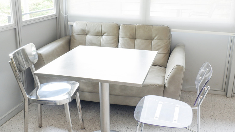 Chrome table and chairs in front of sofa