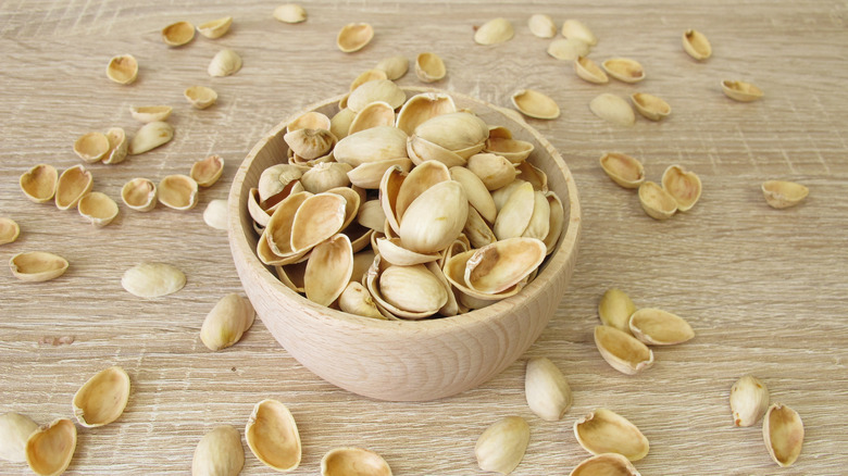 A bowl of empty pistachio shellls