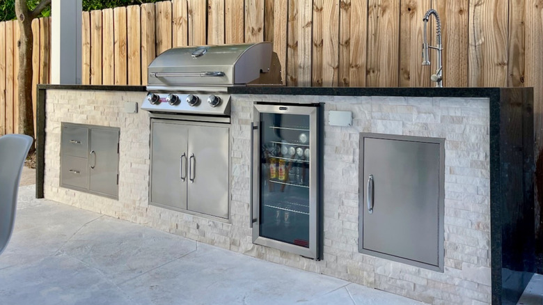 Outdoor grill station with a large stone countertop